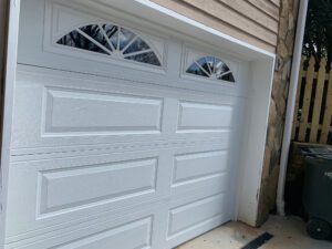 White Long Panel garage door with Wagon Wheel Windows White Long Panel garage door