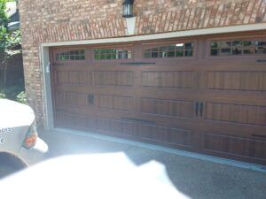 Walnut garage door with Moonlight Windows Walnut garage door with Moonlight Windows